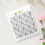 Black and white paisley patterned favor bag, elegant gift packaging with artistic textile detail
