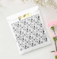 Black and white paisley patterned favor bag, elegant gift packaging with artistic textile detail