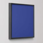 Bold blue abstract art print in a black frame on a light wall, adding a modern minimalist accent to any room.